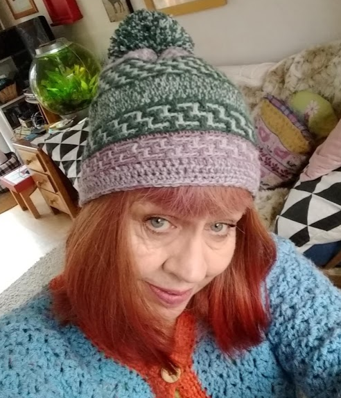 Lindy Zubairy in a Mosaic Crochet Hat and Duchess Stitch cardi